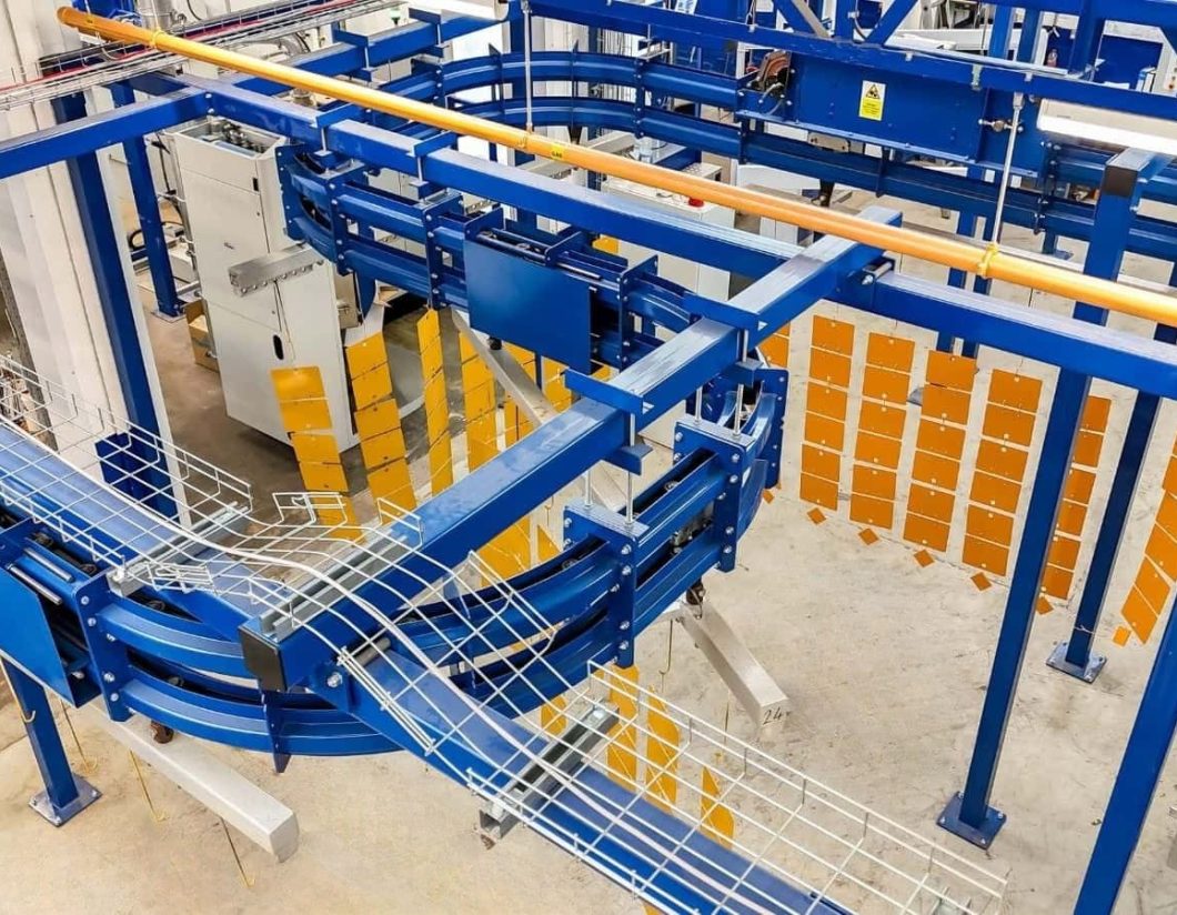Overhead conveyor system for industrial powder coating line in Midlands facility
