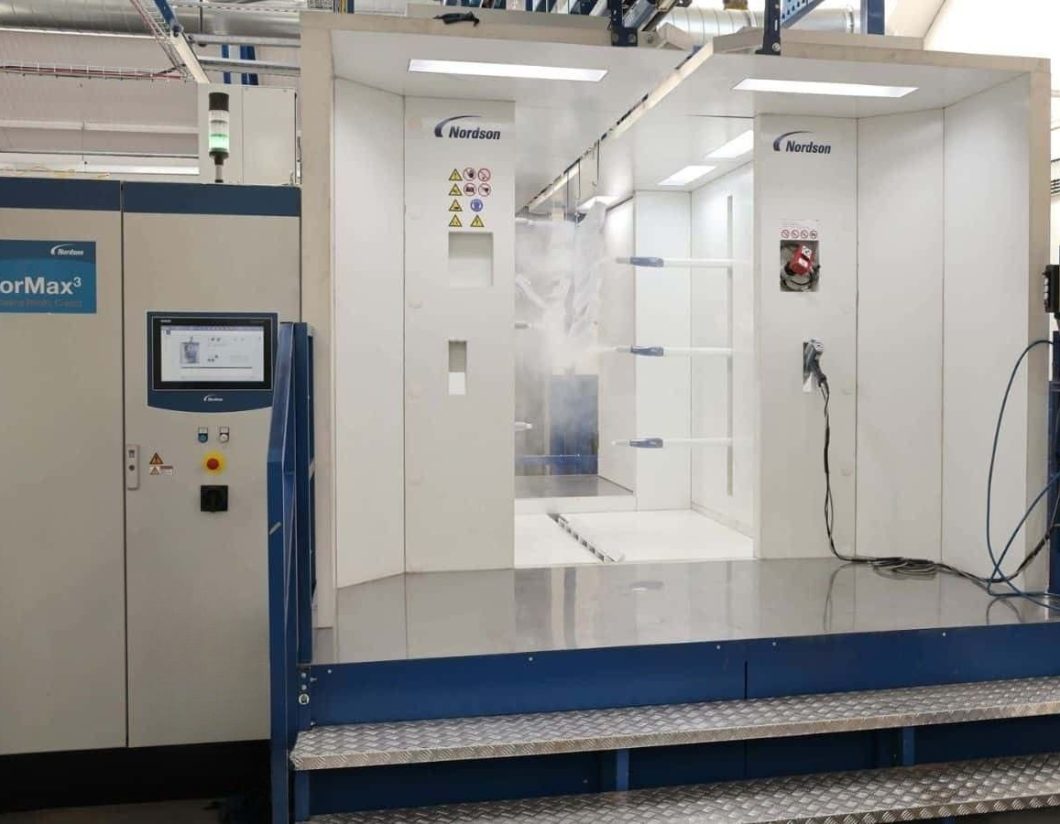 Automated Nordson powder coating booth in Leicestershire industrial finishing facility